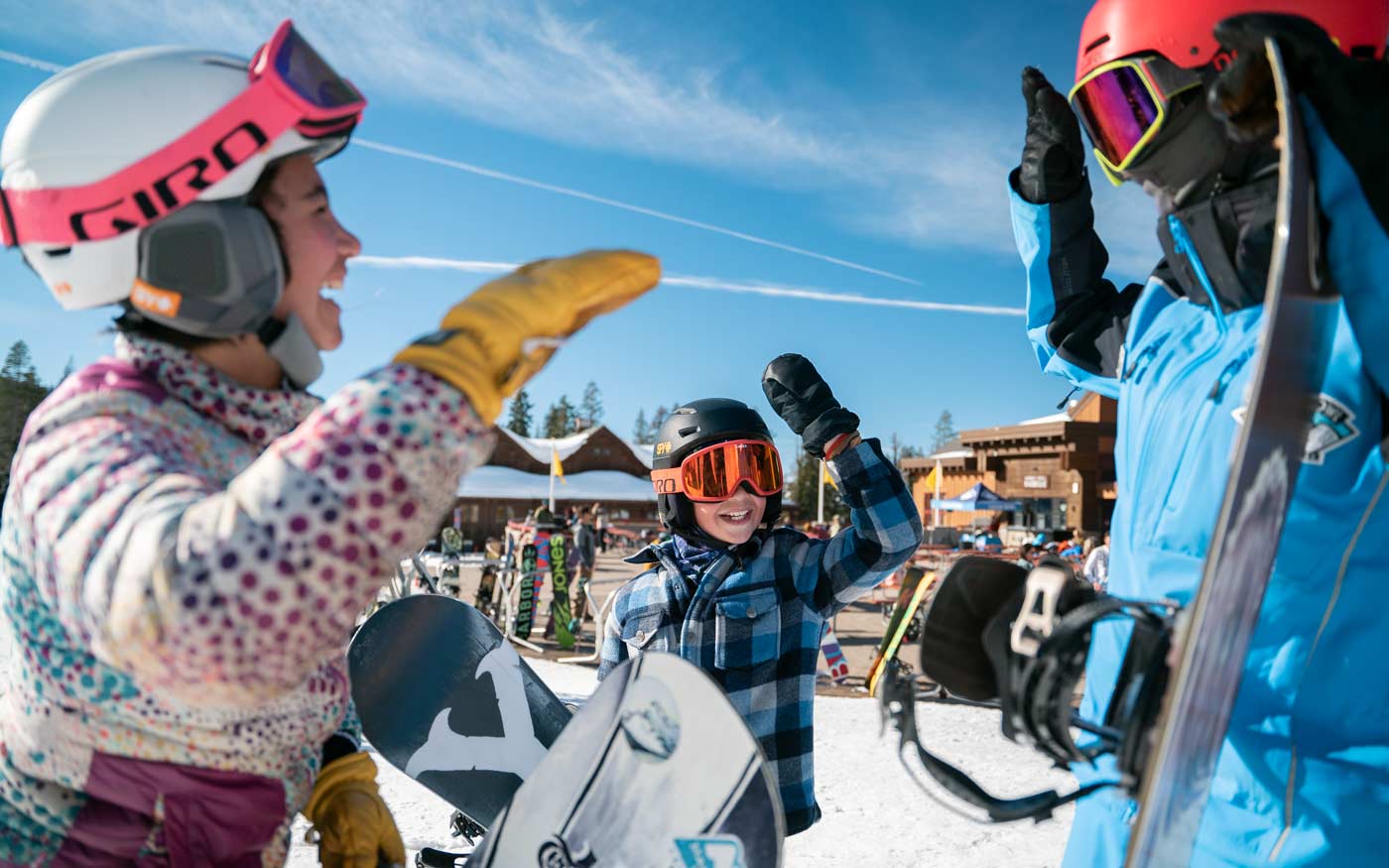 Snowboard team member receiving instructions from a Sugar Bowl snow board team coach.