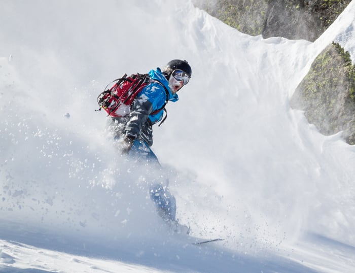 Backcountry snowboarder stoked on the fresh powder behind Sugar Bowl.