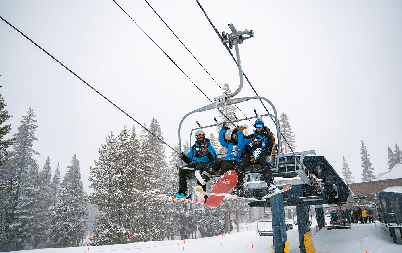 Employees on chairlift for ski break