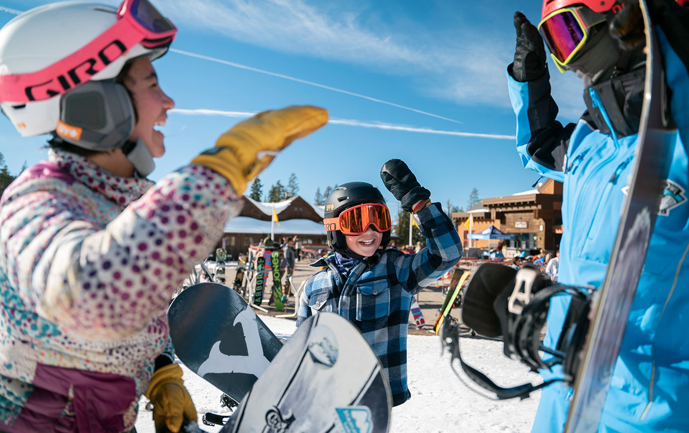 Ski instructor with class having fun