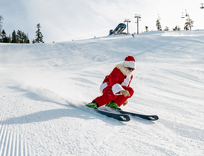 Santa skiing under the Christmas Tree Lift