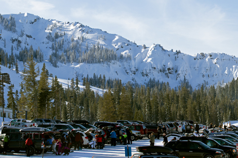 A crowded parking lot in front with Mt. Lincoln in the background.