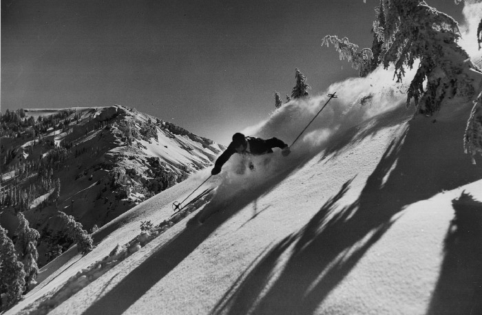 Historical Sugar Bowl Skier, Bill Klein making a left turn through deep powder atop Mt. Disney. Mt. Lincoln is shown in the background.
