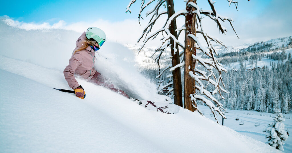 Woman skiing powder