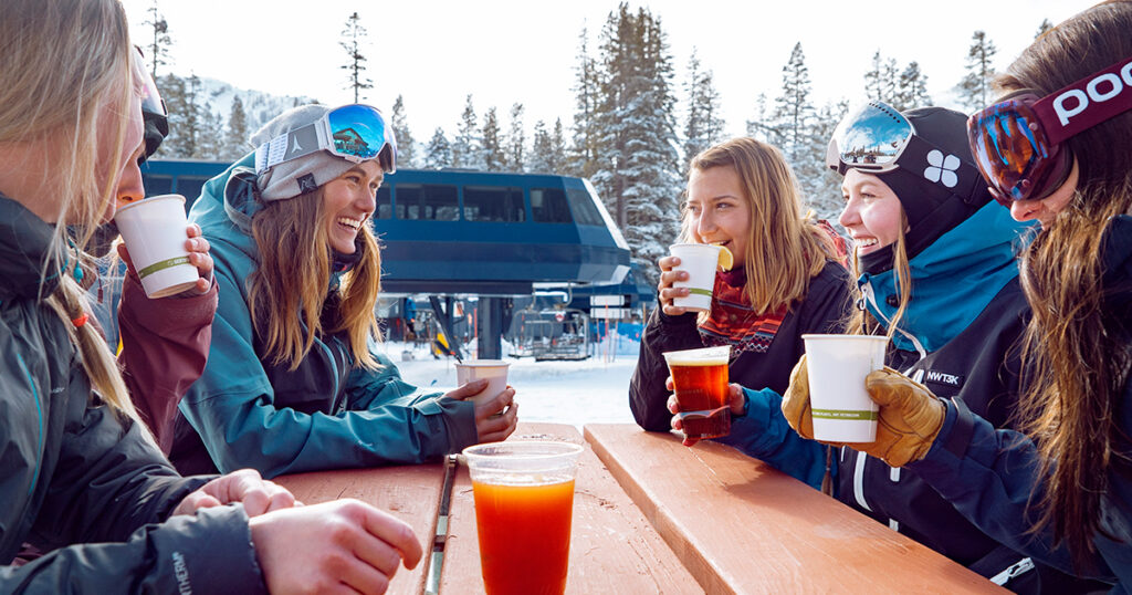 Group of women enjoying a beverage after skiing and riding