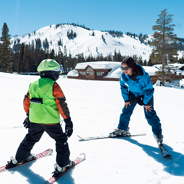 A young child learning to ski. 