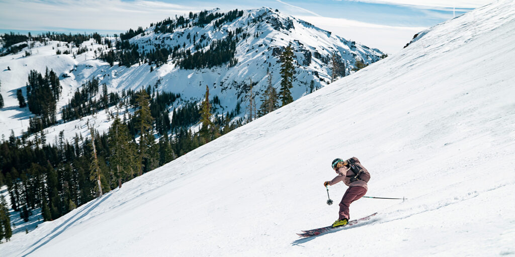 Skier on a sunny day with an expansive view