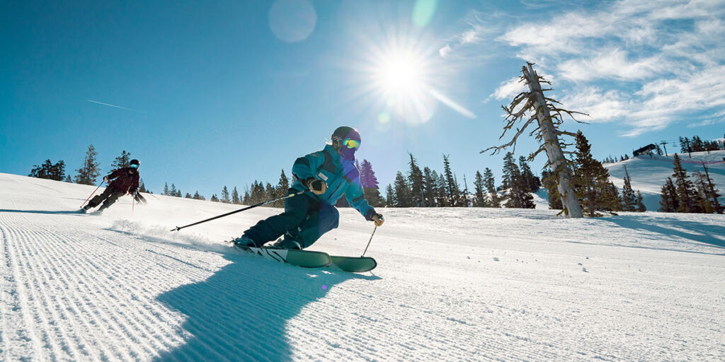 An instructor makes a turn on fresh groomed corduroy.