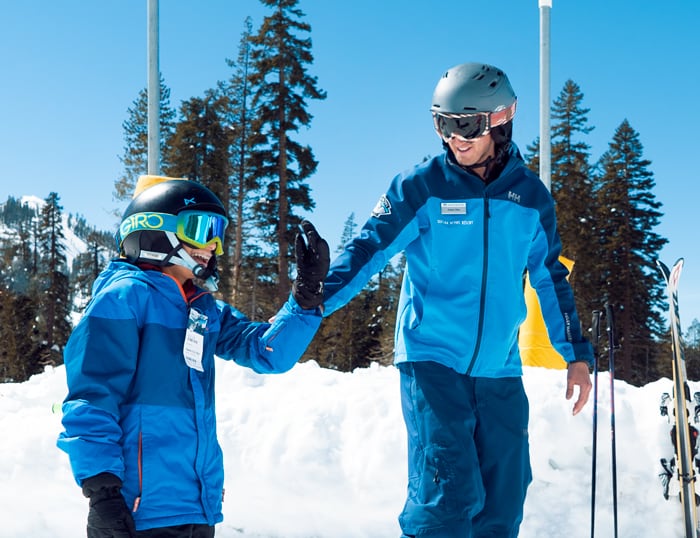 Child skier learning from his friendly Sugar Bowl ski instructor.